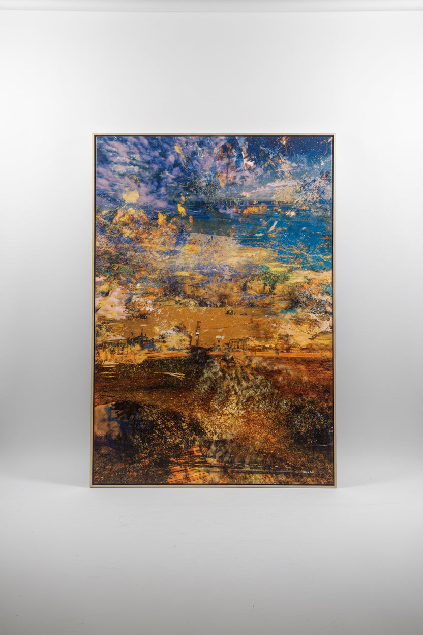 “A Beautiful Transition” artwork by Durham J White, featuring a layered photographic artwork of coastal land and sea formations in warm ochres, sandy hues, and rich coastal blues.