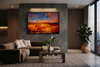 "Fire and Ice" satin black box framed archival canvas print by Durham J White, featuring a layered photographic artwork of the Ballarat landscape with vivid orange and amber reflections against a deep cobalt sky. Styled in a modern interior.