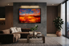 "Fire and Ice" satin black box framed archival canvas print by Durham J White, featuring a layered photographic artwork of the Ballarat landscape with vivid orange and amber reflections against a deep cobalt sky. Styled in a modern interior.