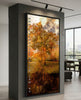 “Grounded” satin black box framed ChromaLuxe metal print by Durham J White, featuring a layered photographic artwork of Honour Avenue in Macedon in saturated burnt oranges, amber tones, and radiant golden yellows. Modern room styled sample.
