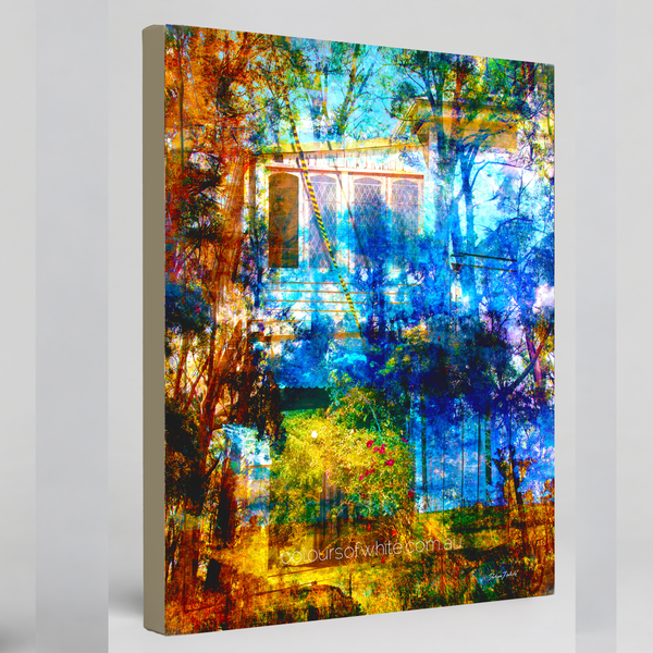 “The Garden Between” archival canvas print by Durham J White, featuring a layered photographic artwork of a heritage cottage framed by russet, amber, ochre, and deep cobalt blue palette.