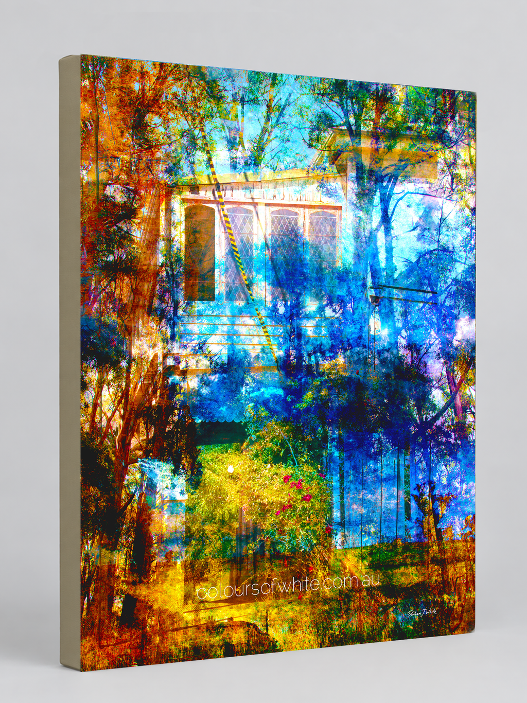 “The Garden Between” archival canvas print by Durham J White, featuring a layered photographic artwork of a heritage cottage framed by russet, amber, ochre, and deep cobalt blue palette.