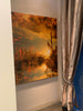 Floating – Kyneton layered photographic urban landscape by Durham J White. Golden reflections and warm amber tones with a dreamlike setting sun. Featured on an entrance wall next to a silver curtain