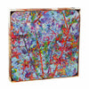 A set of multicolored square coasters with a vibrant floral blossom pattern