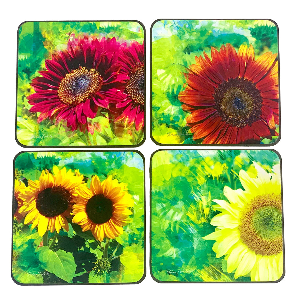 A set of four square coasters featuring different designs of sunflowers with a lime green and red color palette on a background that suggests a garden setting.