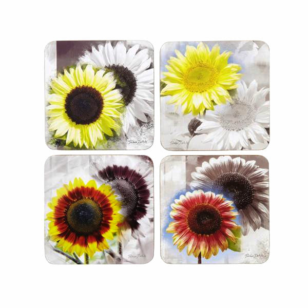 Set of four coasters with sunflower designs in colour on a monotone background, reflecting the foreground