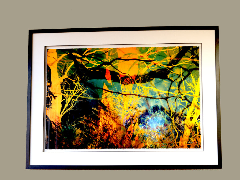 “A Sea Beyond” glass framed fine art print by Durham J White, featuring a layered photographic artwork of the Macedon Ranges in lush forest greens, radiant sunset golds, warm orange-yellows, and subtle atmospheric blues.