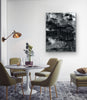 “Moonwalking” archival canvas print by Durham J White, featuring a layered photographic artwork of the Mornington Pier in monochrome with carbon blacks, graphite mid-tones, and crisp whites.  Featured in a modern hotel dining like interior.