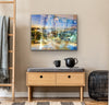 “Keeping Up a Pier Glance 2” archival canvas print by Durham J White, featuring a layered photographic artwork of the Mornington waterfront in luminous pastel blues, subtle lemon highlights, and warm orange accents. Featured in a neutral toned interior