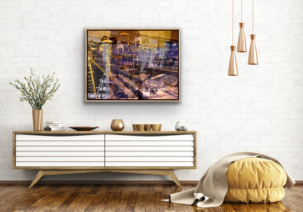 "Keeping Up a Pier Glance 3" Archival canvas print by Durham J White, featuring a layered photographic artwork of the Mornington waterfront with a boat loading dock and pier in earthy purples, sandy caramels, and a glimpse of night sky, shown in a white open-plan living interior.