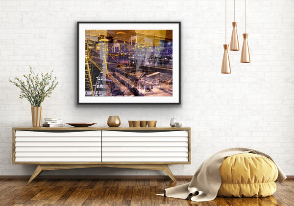 “Keeping Up a Pier Glance 3” glass-framed fine art print by Durham J White, featuring a layered photographic artwork of the Mornington waterfront in deep earthy purples, sandy caramel, and yellow-brown structural accents styled in a white open interior setting.