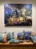 "Melbourne by Night" archival canvas print by Durham J White, featuring Melbourne's iconic skyline in deep cobalt, electric blue, neon gold, and violet nocturnal tones, shown styled with matching Durham J White placemat, coaster, and cushion designs.