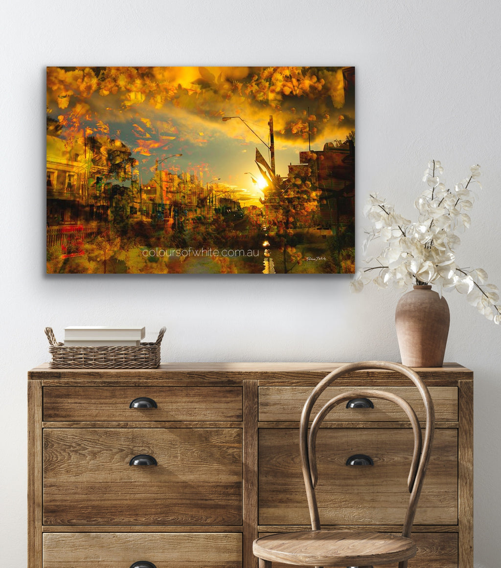 “Piper Street 3view” archival canvas print by Durham J White, featuring a layered photographic artwork of Kyneton's historic Piper Street in radiant ambers, glowing oranges, and earthy golden registers styled in a neutral interior.