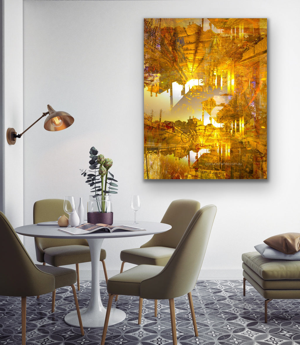 “Pyramids of the Historical Golden New” ChromaLuxe metal print by Durham J White, featuring a layered photographic artwork of Piper Street's historic landmarks in Kyneton in washed copper and golden tones. Styled in a contemporary dining space.