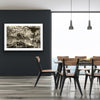 “Shades of the Historical Present Past” glass framed fine art print by Durham J White, featuring a monochromatic layered photographic artwork of Piper Street in Kyneton in rich greys, crisp whites, and ink blacks. Styled on a dark grey wall in a neutral toned interior.