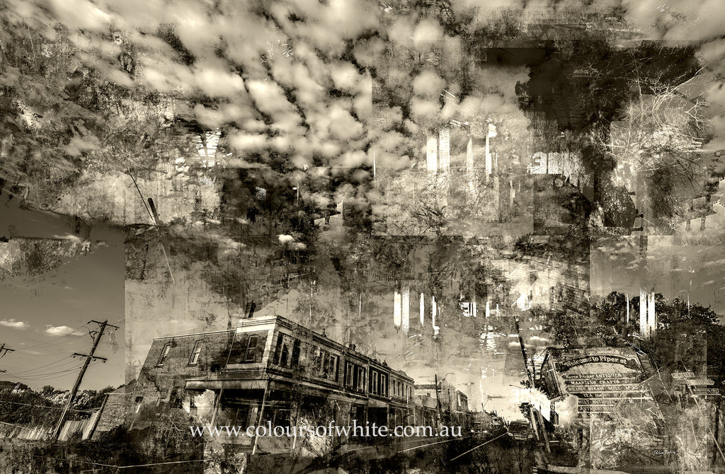 “Shades of the Historical Present Past” wall art by Durham J White, featuring a monochromatic layered photographic artwork of Piper Street in Kyneton in rich greys, crisp whites, and ink blacks in a semi-abstract way with dramatic clouds.
