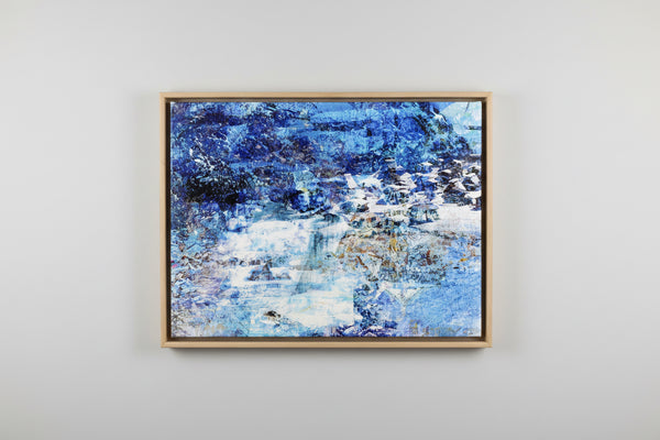 “The Depth of the Huts” Box framed archival canvas print by Durham J White, featuring a Japanese winter landscape artwork of snow-covered huts in cool whites, soft winter blues, and warm undertones of ochre and muted gold.