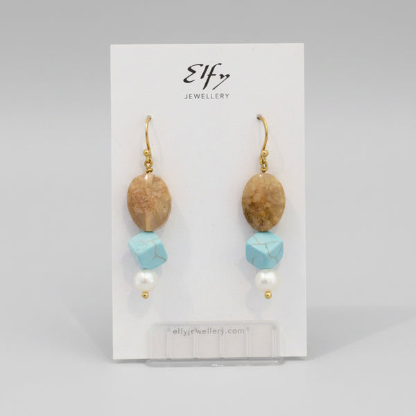A pair of gold-plated hoop earrings with light blue howlite and small pearl accents