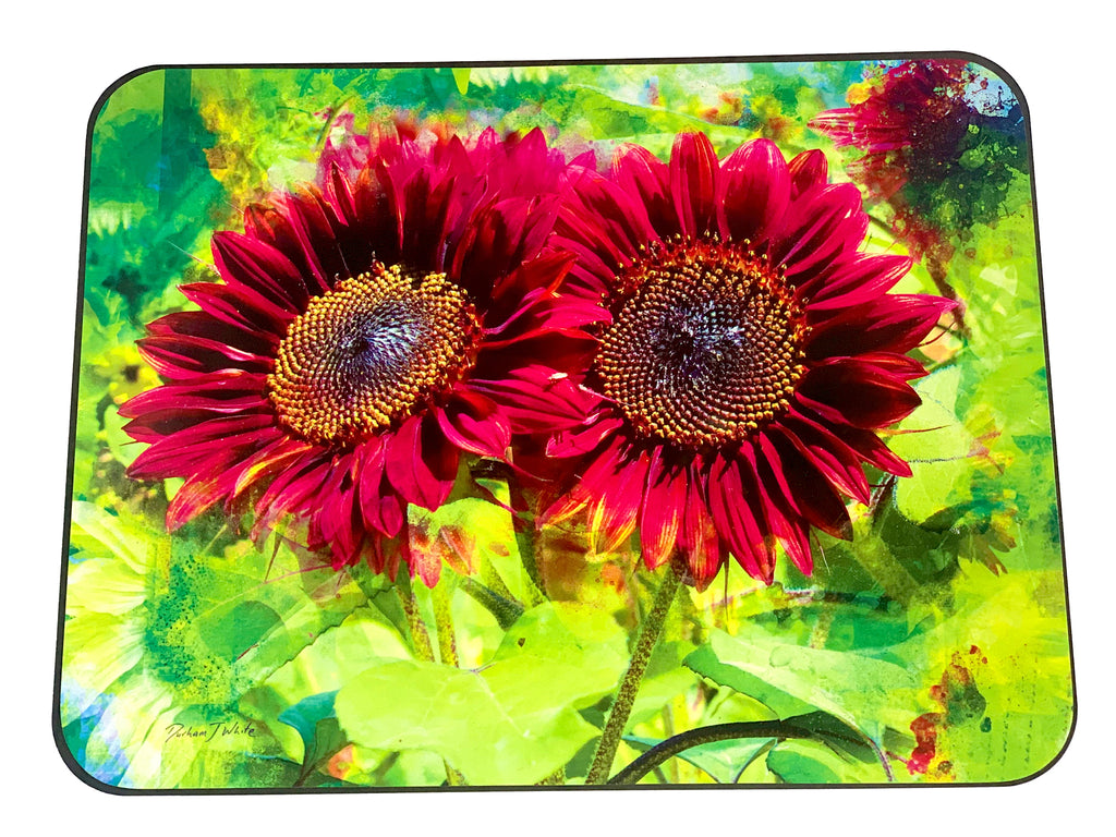 A set of four placemats featuring a vibrant image of red sunflowers with a lime green textural background.
