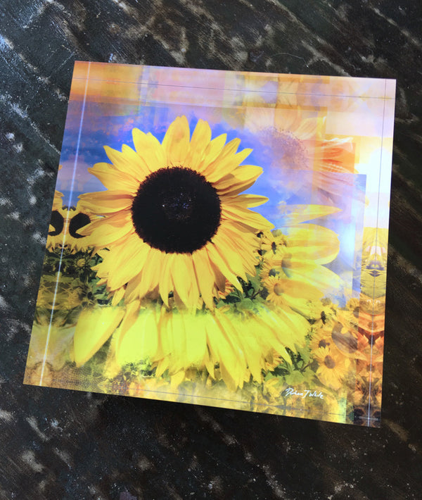 A free-standing decorative art tile featuring a vibrant image of a FleuroSun Classic Gold sunflower with peachy apricot and yellow tones.