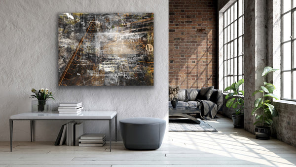A black and white layered photographic artwork featuring a blurred industrial scene with historical buildings, predominantly in shades of gray, copper tones, and varying perspectives.  Featured large in a modern converted warehouse.